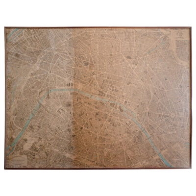 Close-up of a vintage map of Paris in a thin wood frame with aged sun and water patina variations, circa 1966.