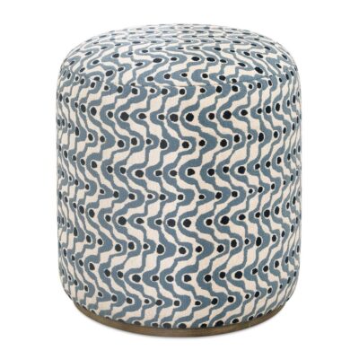 Blue swirl ottoman with navy polka dots on wooden base, close-up image.