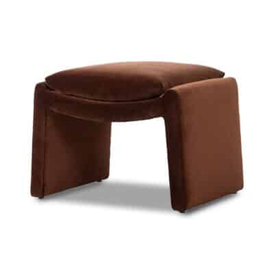 Curved front view of an auburn velvet ottoman.