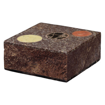Front view of a vintage terrazzo box featuring a hinged lid and circular motif, in an earthy brown tone with contrasting circles.