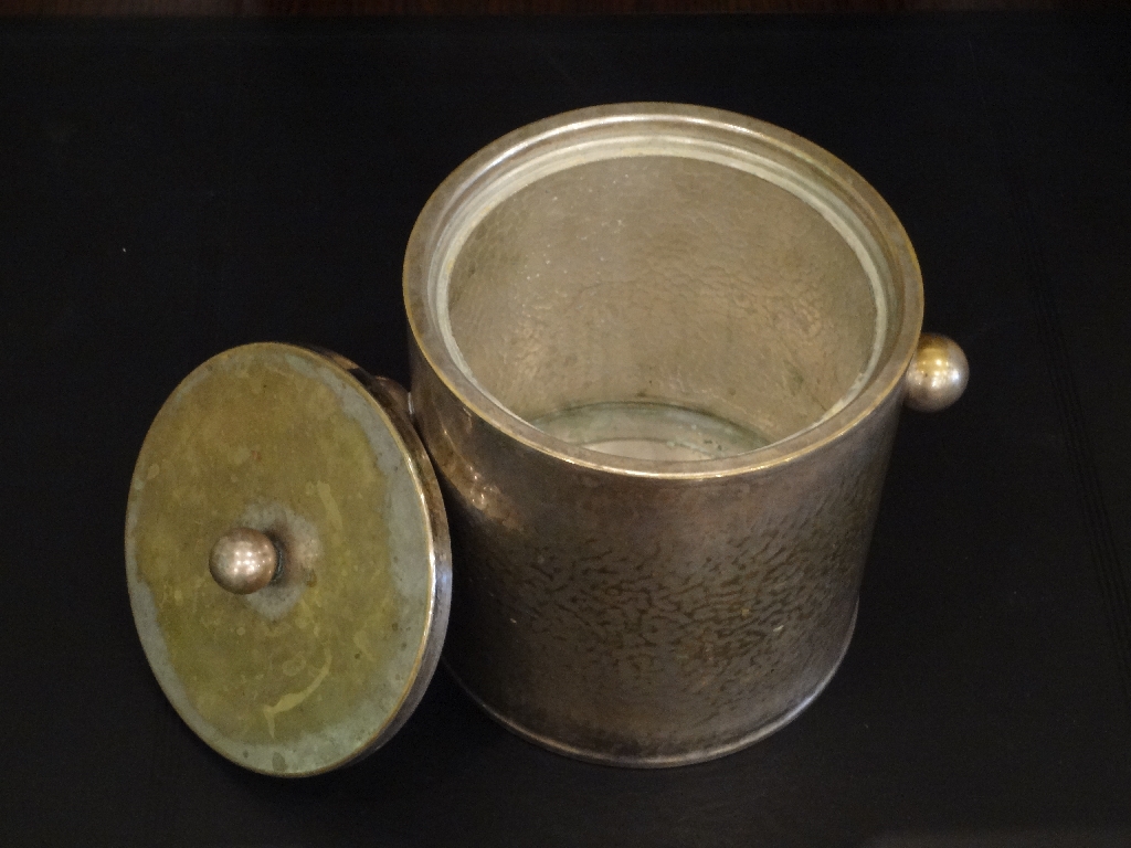 Vintage French "Christian Dior" silver plate ice bucket with a hammered finish, placed on a dark surface.