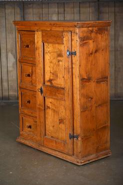 Antique French pine farm cabinet with two interior shelves on right side and four drawers on left side.