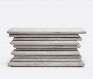Stacked concrete console in light gray, with natural variations in color and minor cracks visible.