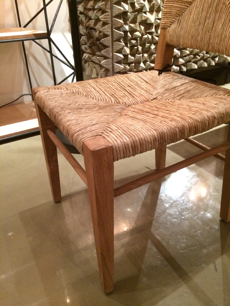Large wooden dining chair with a woven seat and back, featuring a teak frame and seagrass upholstery.