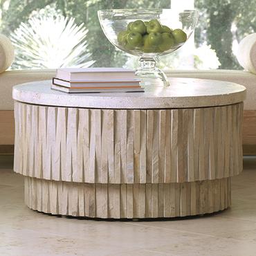 Round stone top coffee table with hand chiseled sides, removable terrazzo top and four glides on base