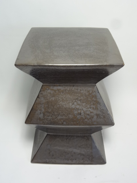 Metal garden stool with a zigzag design available in various colors including gunmetal blue white green light grey and yellow Each stool