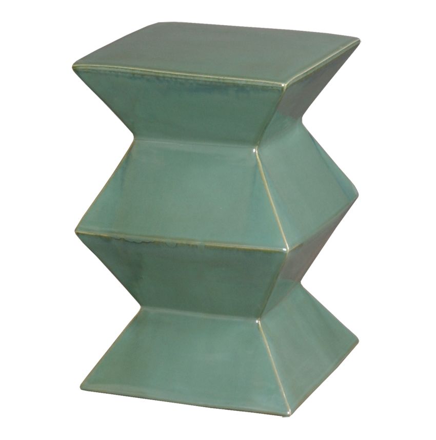 A green ceramic zig zag garden stool with a unique texture and glaze pitting, showcasing its hand-fired and hand-glazed craftsmanship.
