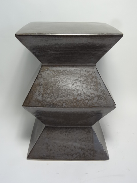 Ceramic zig zag garden stool with unique texture and glaze pitting, available in gunmetal, blue, white, green, light grey and yellow.