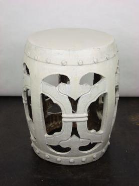 Round garden stool with rivet detail, showcasing its antique appearance and unique texture and glaze variations.