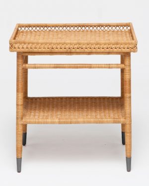 A large wicker side table with intricate natural rattan patterns, standing alone against a white background.
