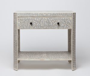 Tanen inlaid bone and resin nightstand with top drawer and two pulls, available in gray resin.