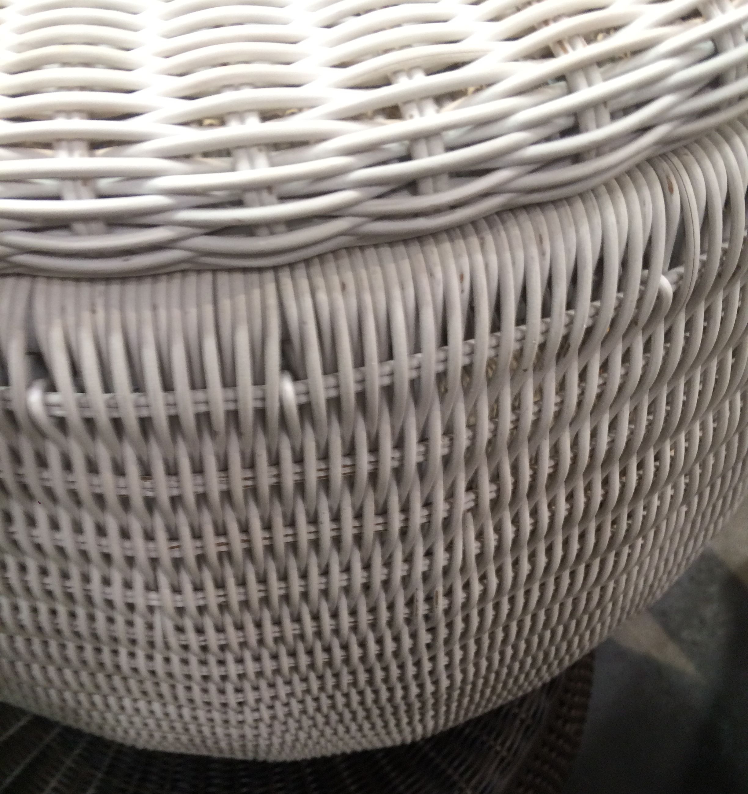 A woven outdoor side table with a removable lid and interior storage presented in two different views a close-up showing the intricate