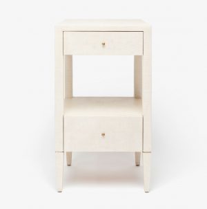 Small white nightstand with a single drawer and a shelf, set against a plain background.