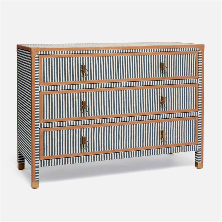 A navy and cream canvas striped dresser with three drawers, each featuring a camel leather handle.