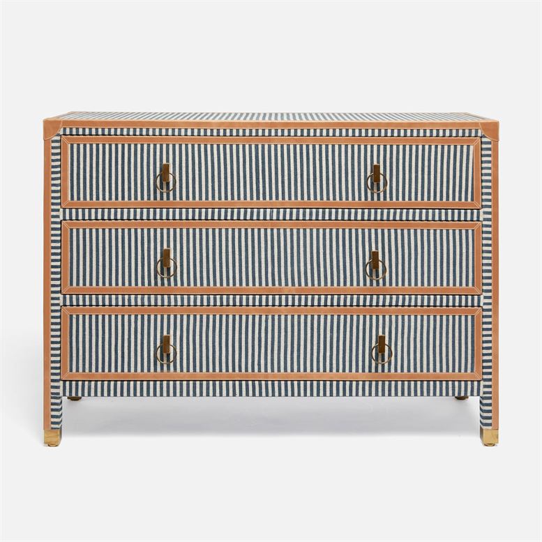 A navy and cream canvas striped dresser with three drawers, featuring camel leather trim.